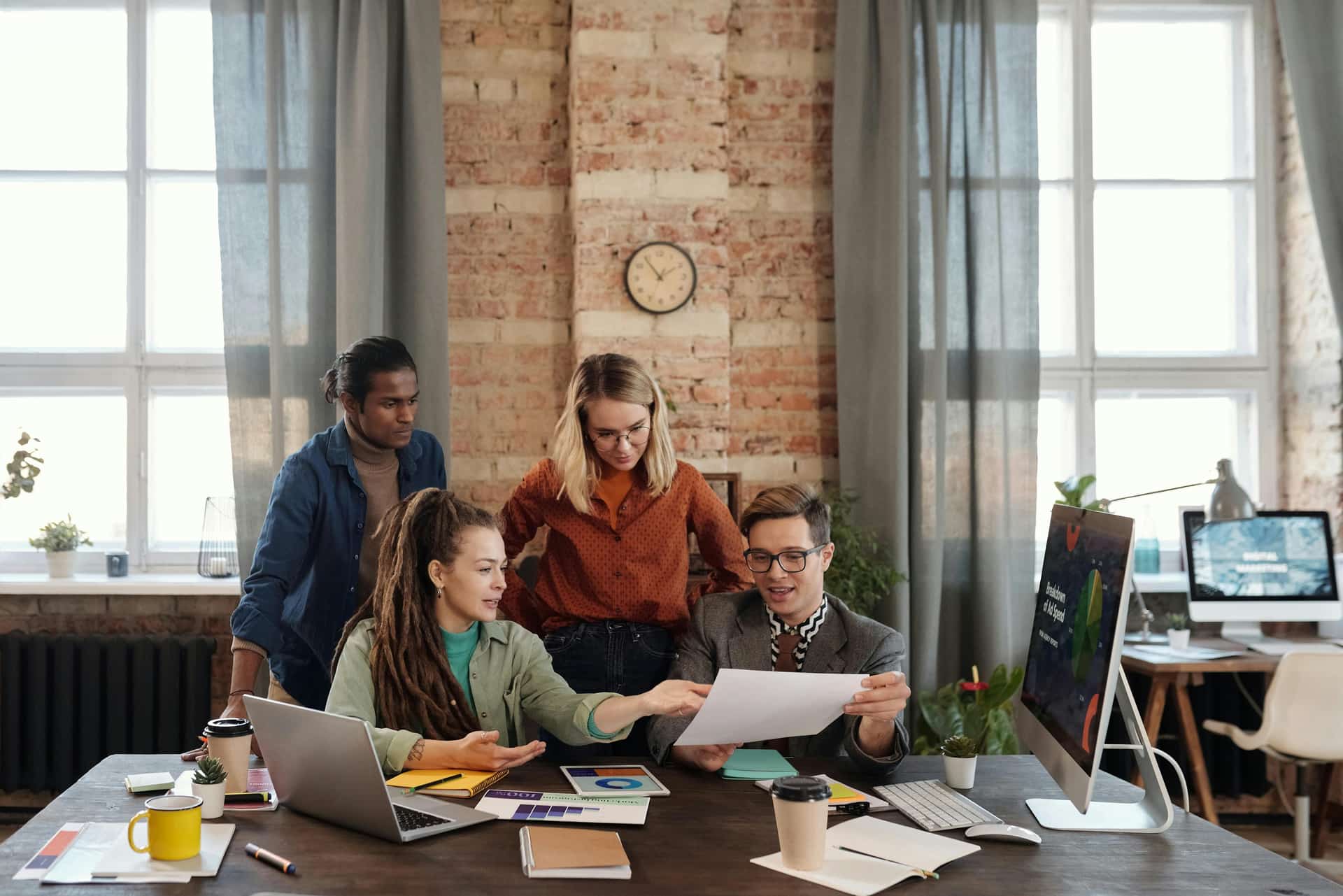 Australian small-business owners reviewing paperwork together