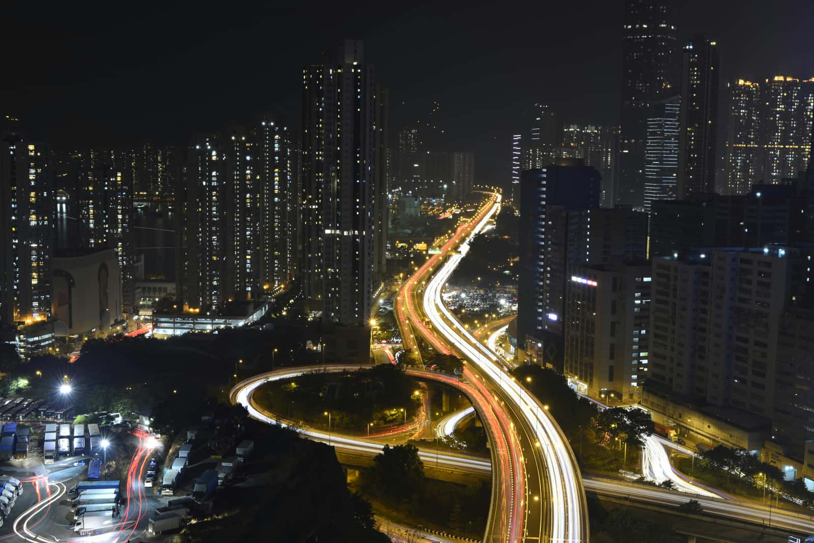 Aerial view of lit arterial roads running through a city at night