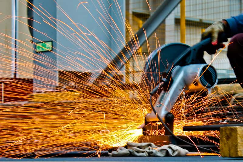 Metal fabrication work underway on a manufacturing floor