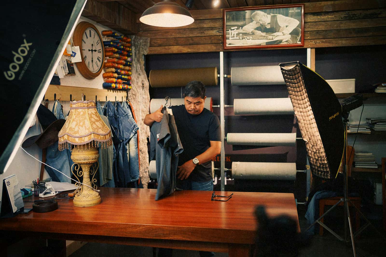 Owner working on the floor of a small retail and repair workshop