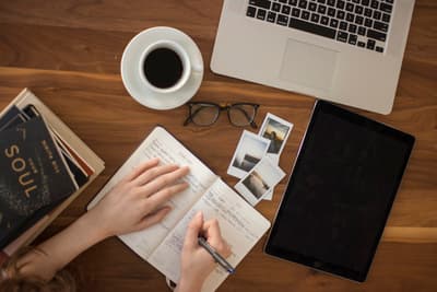 Business owner comparing lending options on a laptop in a modern office