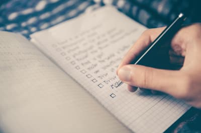 Organised documents and checklist on a desk for a business loan application