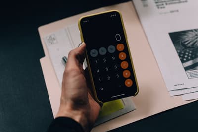 Business owner reviewing tax documents and financial statements at a desk
